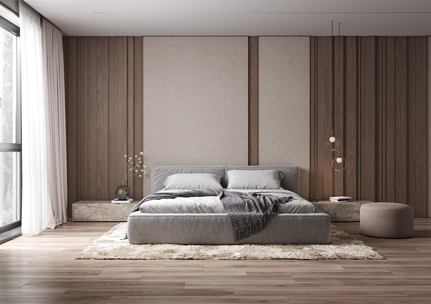 wood flooring with plush area rug in bedroom