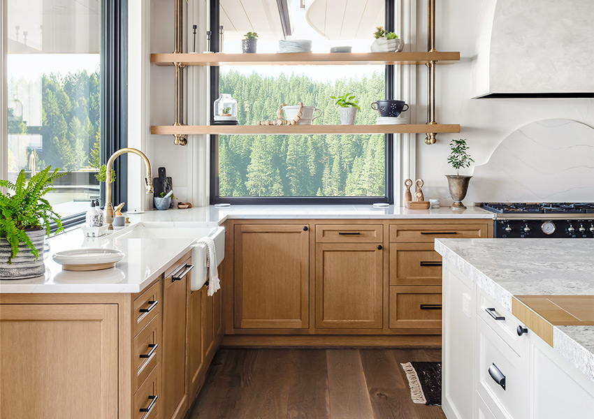 wood flooring in kitchen with large windows and natural light