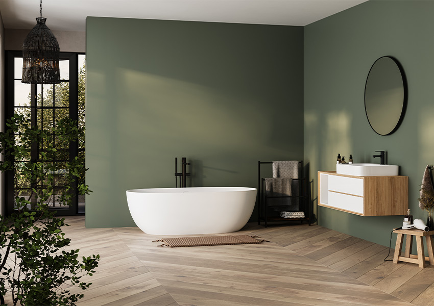 muted green walls in bathroom with herringbone wood floors